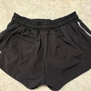 Lot of four pair of size 4 /6 lulu lemon athletica shorts.